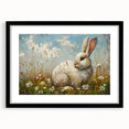 Framed wall art showcasing a whimsical rabbit design, featuring a sleek black frame and mat. Ideal for animal lovers and modern decor enthusiasts, this piece adds a playful touch to any room.