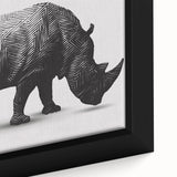 Close-up view of a framed canvas wall art featuring a detailed, artistic depiction of a rhinoceros in a wildlife setting, showcasing rich colors and textures.