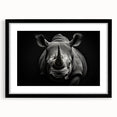 Framed wall art featuring a black-and-white rhinoceros design, showcasing intricate details and textures, perfect for animal lovers and modern home decor.