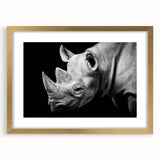 Framed wall art featuring a majestic rhinoceros design in gold, showcasing intricate details and textures, perfect for animal lovers and modern decor enthusiasts.