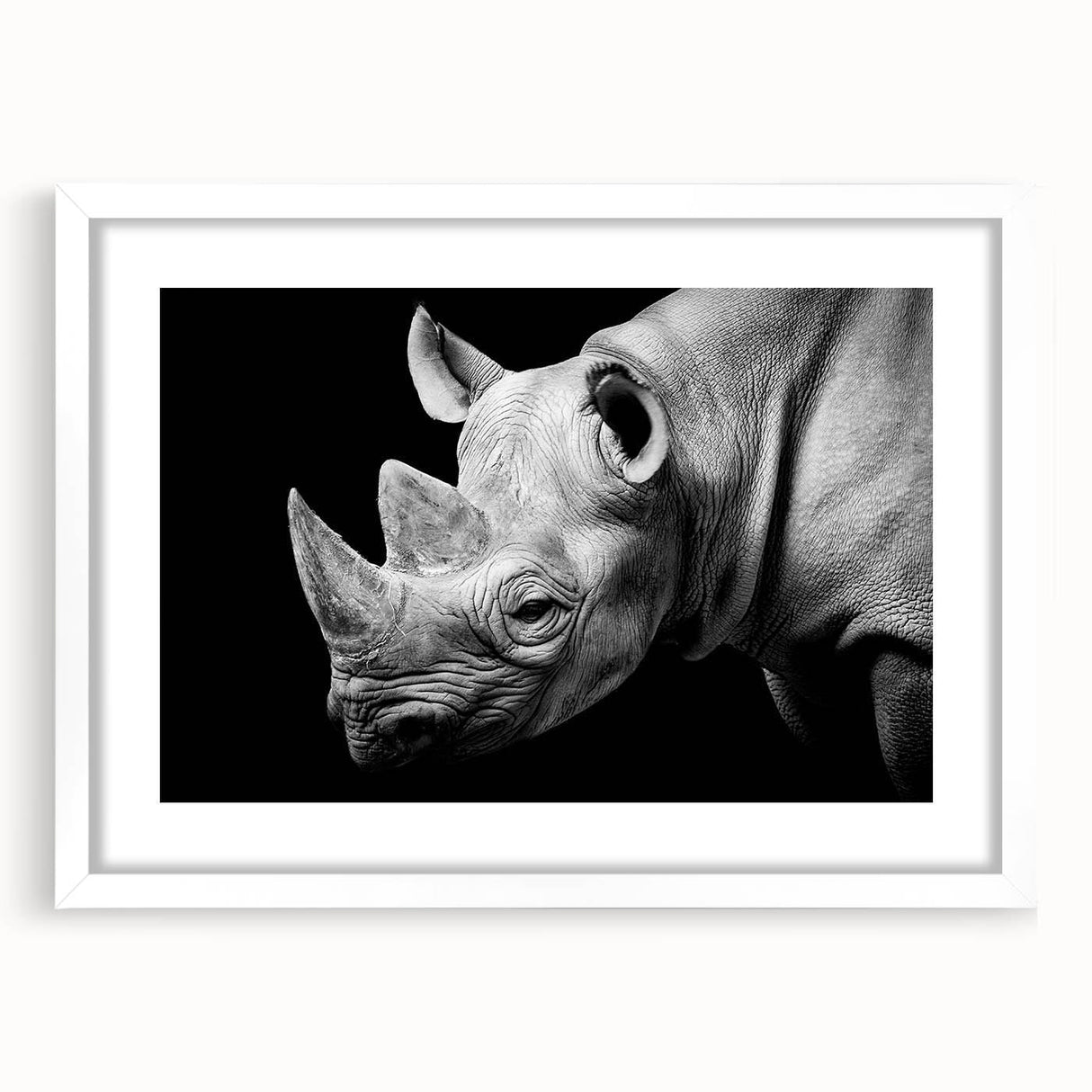 Framed wall art showcasing a striking rhinoceros design in a contemporary style, featuring a white mat and sleek frame, ideal for wildlife enthusiasts and modern decor.