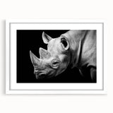 Framed wall art showcasing a striking rhinoceros design in a contemporary style, featuring a white mat and sleek frame, ideal for wildlife enthusiasts and modern decor.