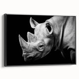 Framed wall art featuring a black side view of a rhinoceros, showcasing intricate design details and vibrant colors, ideal for wildlife enthusiasts' decor.