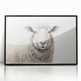 Framed wall art showcasing a serene sheep design in a wild landscape, featuring a sleek black frame and vibrant colors, perfect for enhancing home decor.