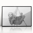 Framed wall art featuring a sloth design in a black frame, showcasing vibrant colors and intricate details, perfect for nature-themed decor and animal lovers.