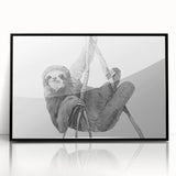 Framed wall art featuring a sloth design in a black frame, showcasing vibrant colors and intricate details, perfect for nature-themed decor and animal lovers.