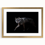 Framed wall art featuring a striking wolf design in gold, showcasing intricate details and textures, perfect for animal lovers and home decor enthusiasts.
