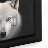 Close-up of a framed canvas wall art featuring a striking wolf design, showcasing intricate details and vibrant colors, perfect for wildlife enthusiasts' decor.