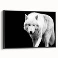 Framed canvas wall art showcasing a striking black and white wolf design, perfect for wildlife enthusiasts, set against a sleek black frame for a modern decor touch.