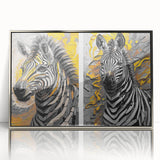 Framed wall art featuring a striking zebra design in black and white with a sleek silver frame, perfect for modern decor, showcasing wildlife elegance.