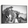 Framed canvas wall art showcasing a striking black and white zebra design, ideal for wildlife enthusiasts. The artwork adds a modern touch to any decor, emphasizing the beauty of nature in a stylish way.