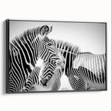 Framed canvas wall art showcasing a striking black and white zebra design, ideal for wildlife enthusiasts. The artwork adds a modern touch to any decor, emphasizing the beauty of nature in a stylish way.