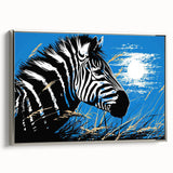 Framed canvas wall art showcasing a striking zebra design in black and white, set against a silver frame, perfect for adding a modern touch to any decor.