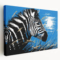 Side view of a stretched canvas wall art featuring a striking zebra design, showcasing bold black and white stripes against a vibrant background, ideal for wildlife enthusiasts.