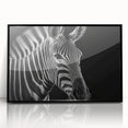 Framed acrylic wall art featuring a striking zebra design in black and white, ideal for wildlife enthusiasts seeking modern decor. Perfect for adding a touch of nature-inspired elegance to any room.