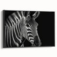 Framed canvas wall art featuring a striking black and white zebra design, showcasing intricate details and textures, perfect for wildlife enthusiasts and modern decor.