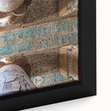 Close-up of a black framed canvas featuring colorful, textured depiction of ancient ruins.