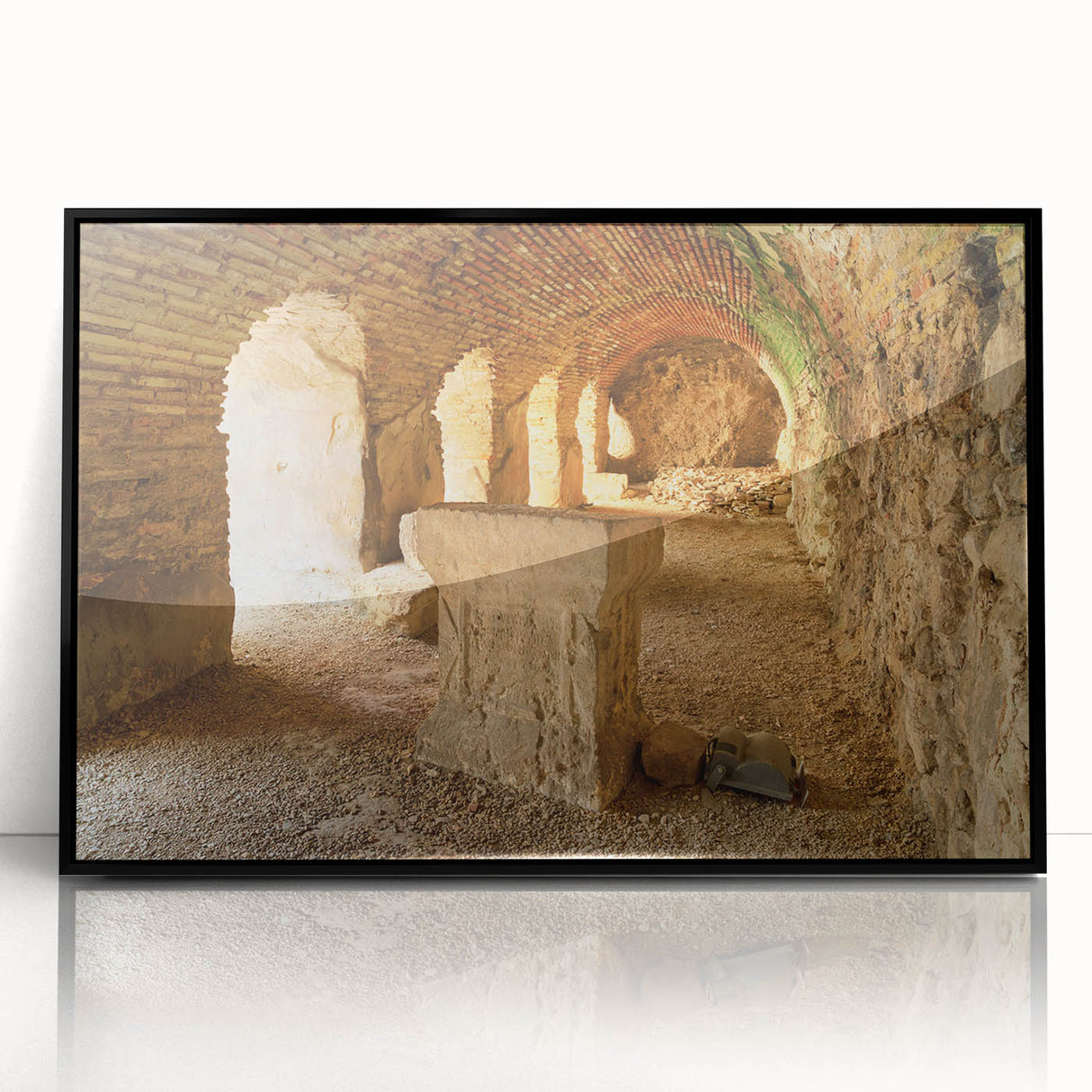 Large abstract wall art of ancient ruins in muted earth tones, framed in black acrylic, suited for a modern living room.
