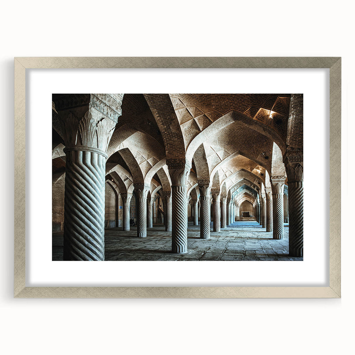 Abstract art print featuring geometric arch designs in muted gray, framed in silver, ideal for dining room decor.