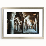 Abstract art print featuring geometric arch designs in muted gray, framed in silver, ideal for dining room decor.