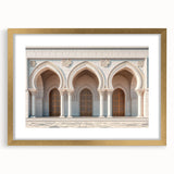 Abstract art print of interlocking arches in gold and white, framed with a gold mat.