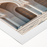 Art Deco poster featuring symmetrical arches in muted beige and ivory, printed on rolled canvas.