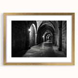 Abstract art print featuring symmetrical arch designs in muted gold and white tones on a framed canvas.
