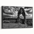 Black and white wall art featuring a series of architectural arches, printed on framed canvas, ideal for bedroom wall decor.