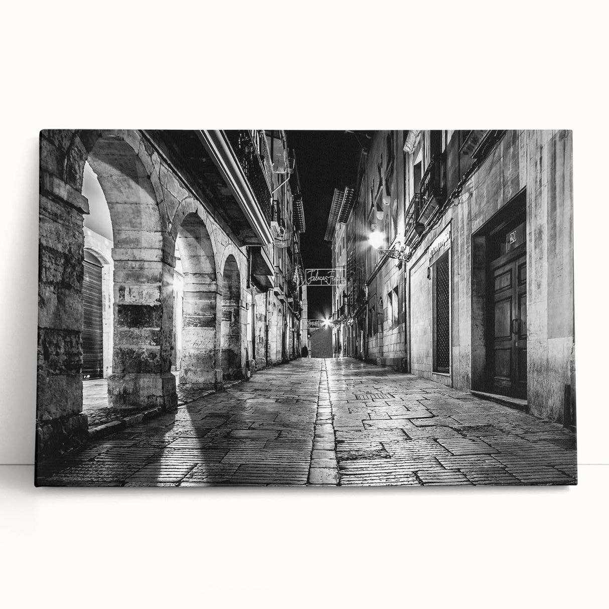 Black and white photo of architectural arches on stretched canvas, ideal for kitchen wall art or bedroom ambiance.