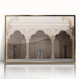 Mid-century modernist art featuring symmetrical arch designs in gold and black on a framed acrylic.