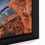 Close-up of black wall art featuring colorful, textured arch designs on a framed canvas, ideal for living room decor.