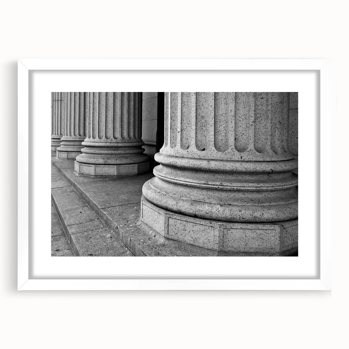 Abstract art print featuring geometric columns in gray tones, framed in white, suitable for bedroom or dining room decor.