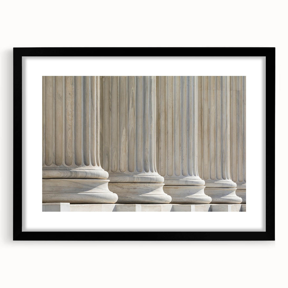 Abstract art print featuring textured, colorful patterns on a large canvas, framed in black, ideal for living room decor.