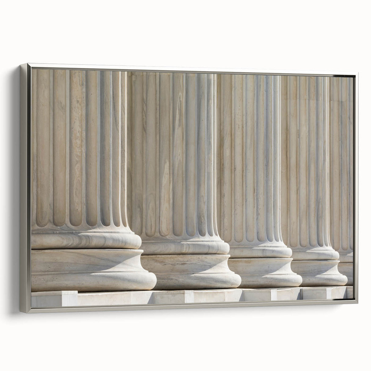 Framed canvas depicting a landscape with colorful, vintage-style columns, ideal for adding a classic touch to a living room.