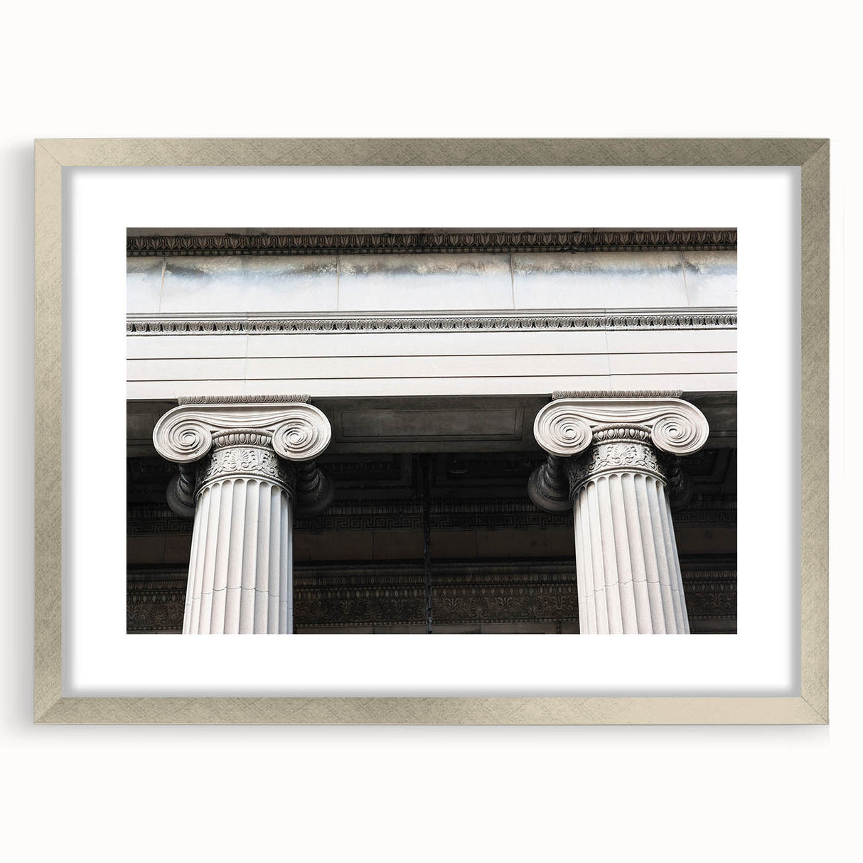Textured abstract art print featuring overlapping columns in muted beige, framed in silver, ideal for bedroom art.