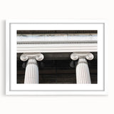 Abstract art print featuring a series of vertical columns in muted gray and white, framed in white.