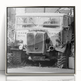 Mid-century modernist art depicting a derelict building, in muted gray and silver tones, acrylic framed poster.