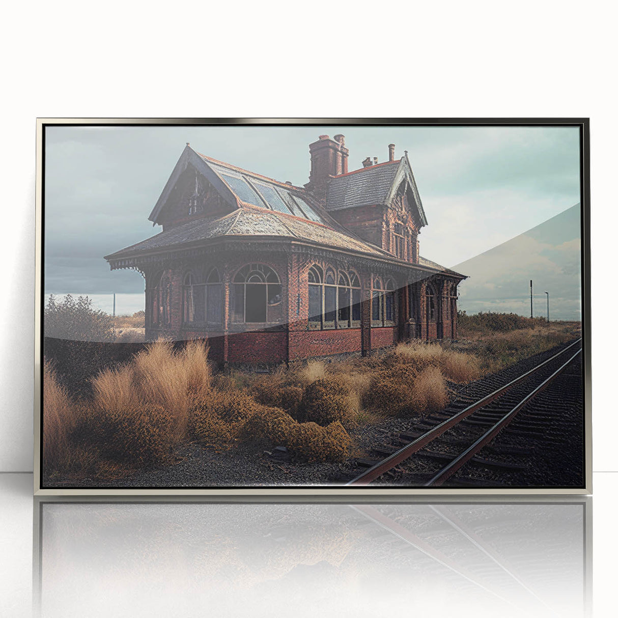 Mid-century modernist art depicting a silver-framed acrylic print of architectural dereliction.