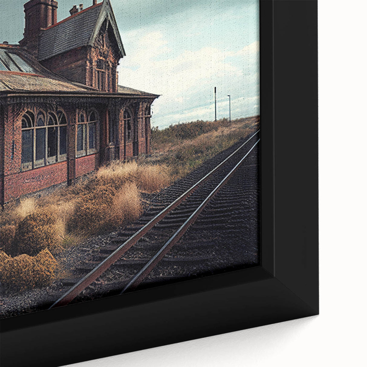 Black and white framed canvas featuring a vintage landscape of derelict buildings, ideal for bedroom decor.