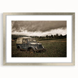 Textured art print featuring abstract design in neutral tones on a silver-framed mat, ideal for bedroom wall decor.