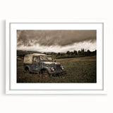 Abstract art print featuring geometric shapes in muted gray and blue tones on white framed canvas.