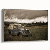 Framed canvas featuring a vintage-style landscape painting with colorful elements on a black background.
