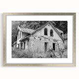 Textured abstract art print in muted gray and silver tones on a framed canvas, ideal for modern bedroom ambiance.