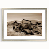 Textured abstract art print in silver frame, featuring a blend of gray and white tones, suitable for bedroom decor.