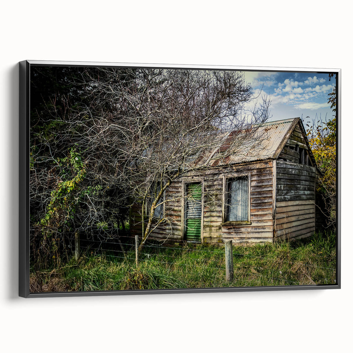 Black and white wall art featuring a vintage landscape painting on framed canvas, ideal for bedroom decor.