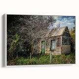 Vintage poster art of a derelict building on a framed canvas, featuring a black and colorful palette.