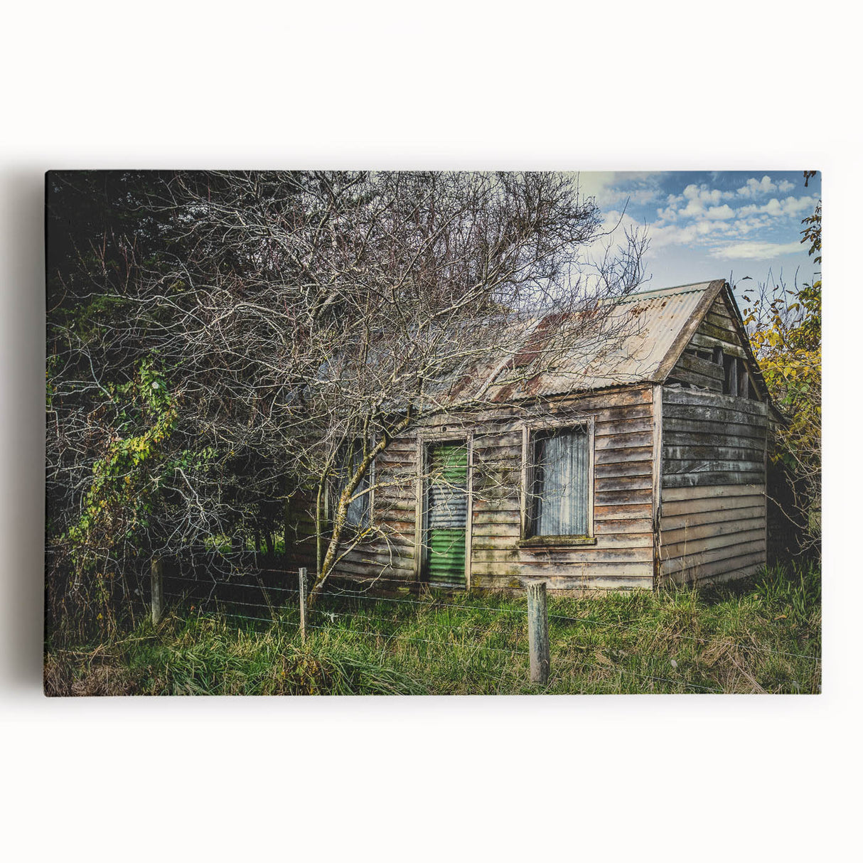 Black and white photograph of a dilapidated building on stretched canvas, ideal for kitchen wall art or bedroom ambiance.