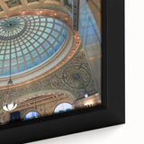 Close-up of black wall art featuring colorful, textured domes on a framed canvas, ideal for living room decor.