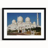 Abstract art print featuring colorful, textured domes on a large black-framed canvas, suitable for living room decor.