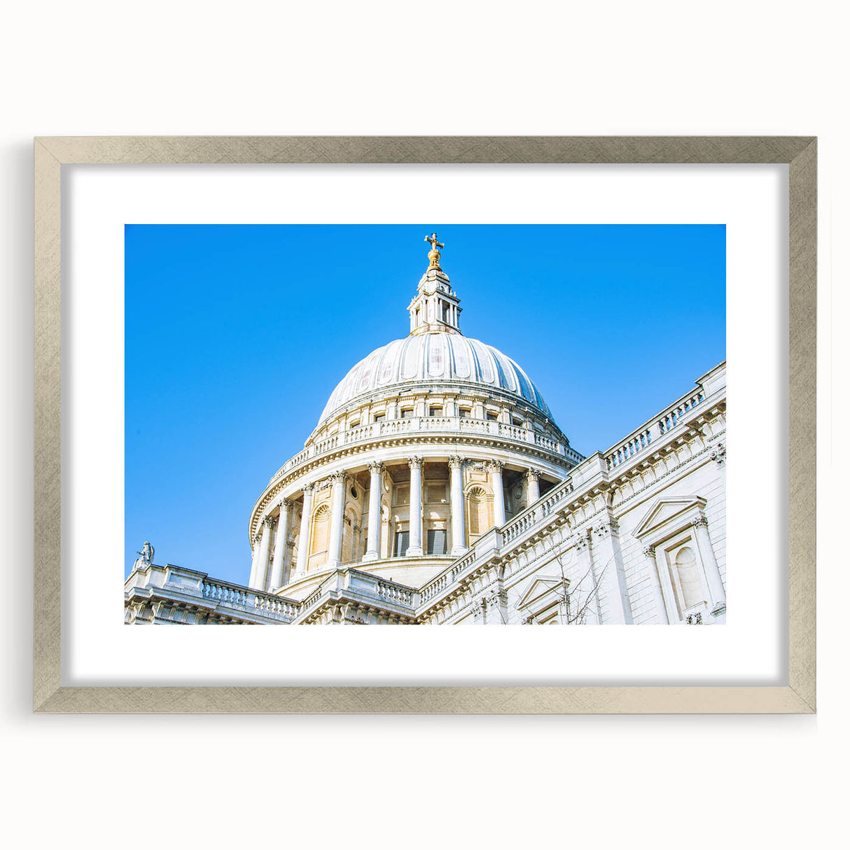 Textured abstract art print depicting architectural domes in muted gray tones on a silver-framed mat.